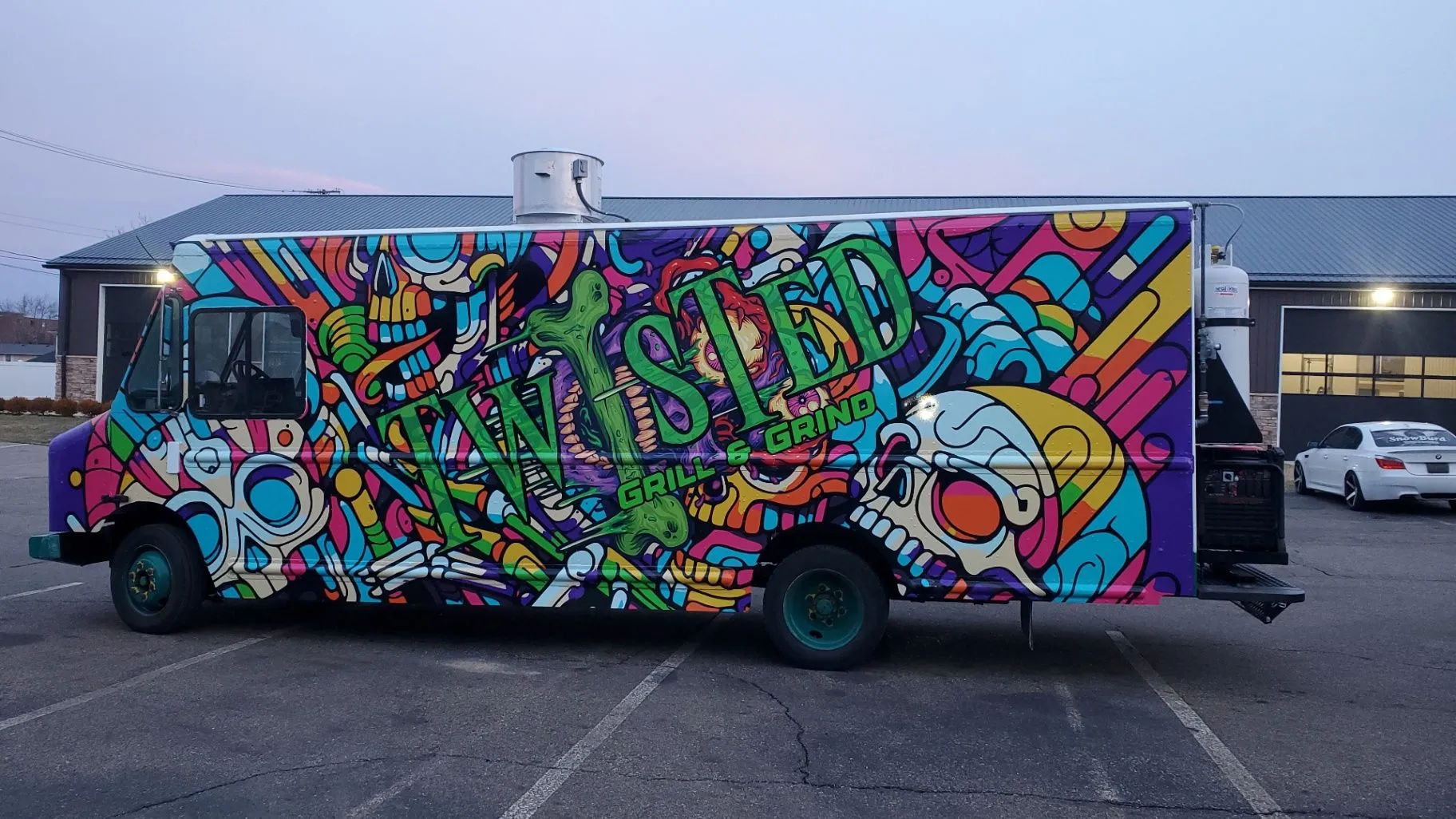 Twisted Grill & Grind food truck with a full illustrated wrap
